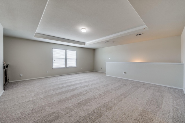 3133 Montserrat Creek Dr, Little Elm, TX 75068 - empty room featuring a raised ceiling and light carpet