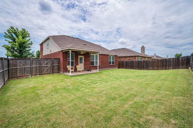 3133 Montserrat Creek Dr, Little Elm, TX 75068 - rear view of house featuring a patio, brick siding, and a fenced backyard