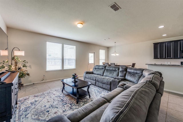 3133 Montserrat Creek Dr, Little Elm, TX 75068 - living room featuring a chandelier, light tile patterned floors, and recessed lighting