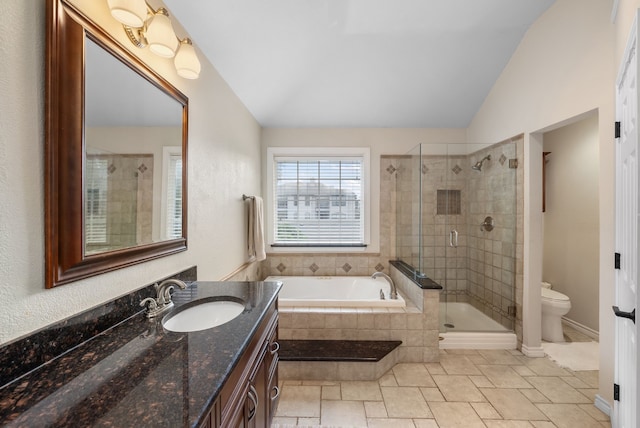 8571 Hidden Spring Dr, Frisco, TX 75034 - bathroom with vaulted ceiling, a bath, vanity, and a stall shower