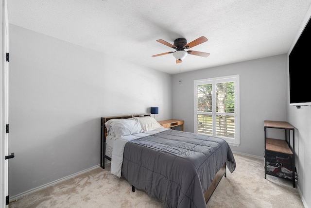8571 Hidden Spring Dr, Frisco, TX 75034 - bedroom featuring light colored carpet, ceiling fan, and a textured ceiling