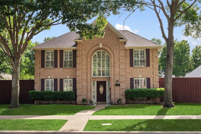 8571 Hidden Spring Dr, Frisco, TX 75034 - view of front facade featuring brick siding and roof with shingles