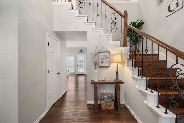 8571 Hidden Spring Dr, Frisco, TX 75034 - foyer featuring hardwood / wood-style floors, stairs, and a towering ceiling