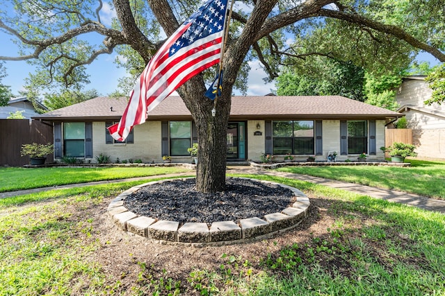 2912 Marsann Ln, Farmers Branch, TX 75234 - view of front facade with brick siding and roof with shingles