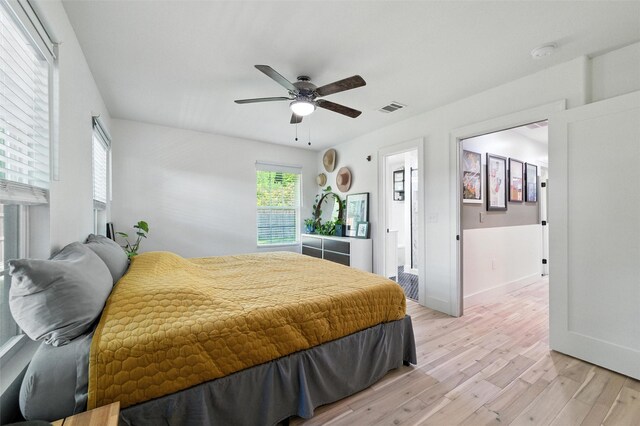 3056 Valley View Ln, Farmers Branch, TX 75234 - bedroom featuring light wood-type flooring and ceiling fan