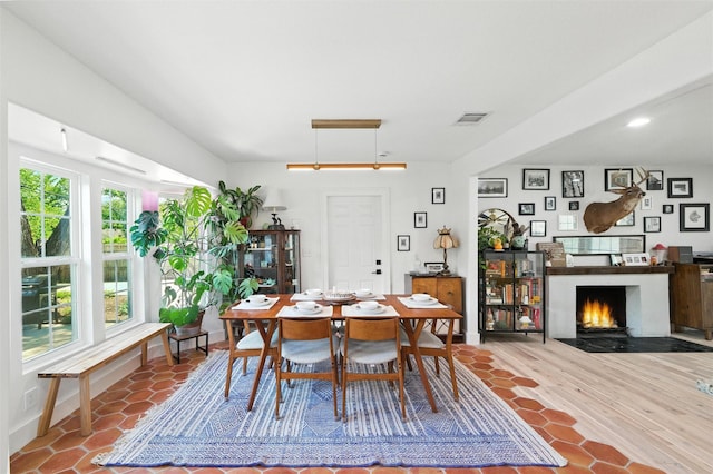 3056 Valley View Ln, Farmers Branch, TX 75234 - dining space with a fireplace with flush hearth and recessed lighting