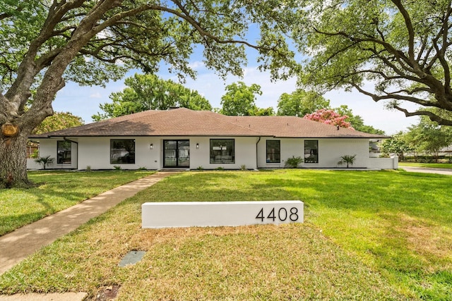 4408 Thunder Rd, Dallas, TX 75244 - view of front of home featuring a front yard and stucco siding