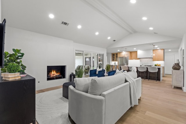 4408 Thunder Rd, Dallas, TX 75244 - living area with light wood-style floors, a lit fireplace, and recessed lighting