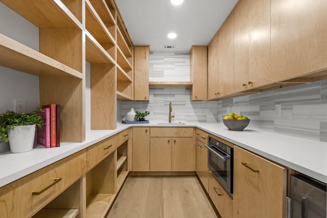 4408 Thunder Rd, Dallas, TX 75244 - kitchen featuring open shelves, wall oven, light brown cabinetry, light wood-style flooring, and recessed lighting