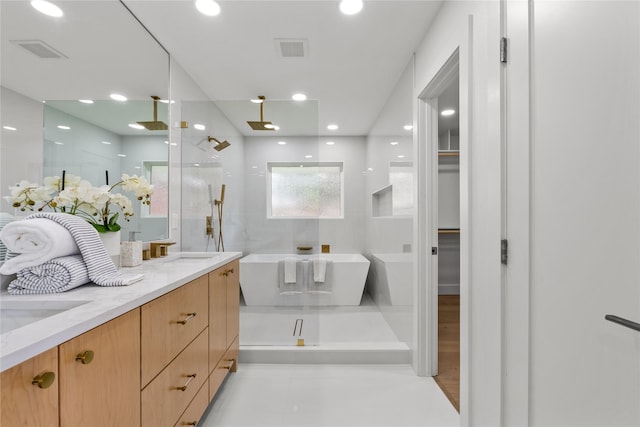 4408 Thunder Rd, Dallas, TX 75244 - full bathroom featuring a shower stall, a spacious closet, a soaking tub, double vanity, and recessed lighting