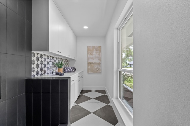 4408 Thunder Rd, Dallas, TX 75244 - kitchen with light countertops, white cabinets, modern cabinets, recessed lighting, and backsplash