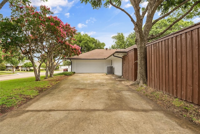 4408 Thunder Rd, Dallas, TX 75244 - view of property exterior featuring a central AC unit and a garage