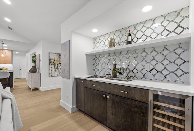 4408 Thunder Rd, Dallas, TX 75244 - indoor wet bar featuring wine cooler, tasteful backsplash, light wood-style floors, recessed lighting, and lofted ceiling