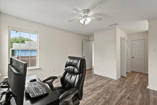 2210 Nantucket Village Cir, Dallas, TX 75227 - office area featuring ceiling fan, wood finished floors, and a textured ceiling