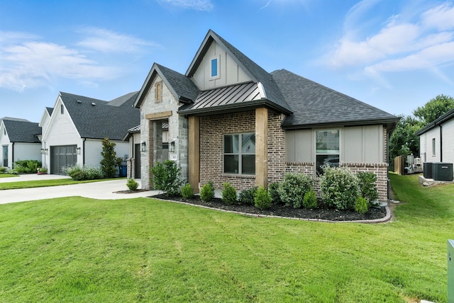 303 Highland Ct, Aledo, TX 76008 - view of front of property with brick siding, a standing seam roof, a front yard, a shingled roof, and concrete driveway