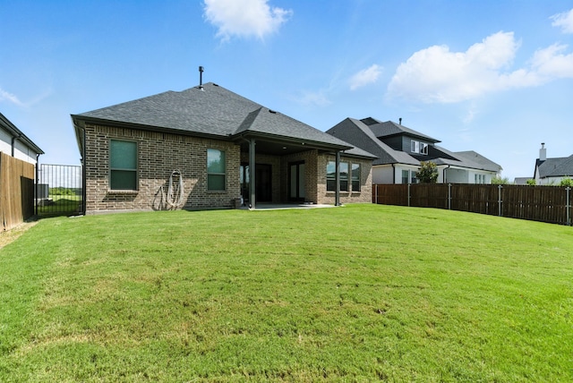 303 Highland Ct, Aledo, TX 76008 - back of property with brick siding, roof with shingles, and a patio area