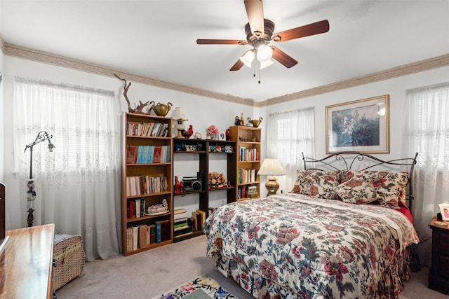 1104 Center St, Cleburne, TX 76033 - carpeted bedroom featuring a ceiling fan and crown molding