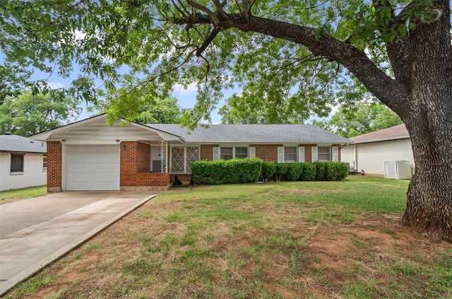 1104 Center St, Cleburne, TX 76033 - single story home featuring a garage, brick siding, driveway, and a front lawn