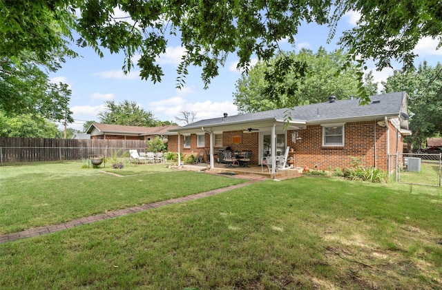 1104 Center St, Cleburne, TX 76033 - rear view of property featuring brick siding, a fenced backyard, a patio, and ceiling fan