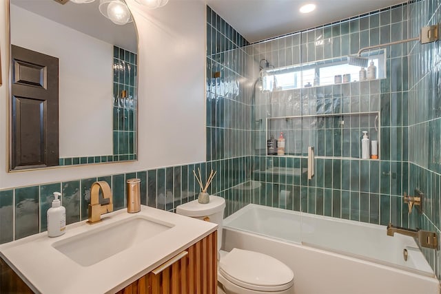 2620 Coldstream Dr, Fort Worth, TX 76123 - full bath with tile walls, bath / shower combo with glass door, vanity, and recessed lighting