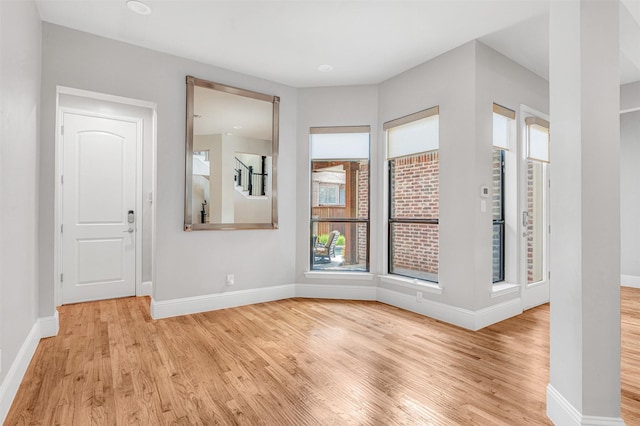 11334 Graceland Ln, Frisco, TX 75033 - empty room with light wood-style floors and baseboards