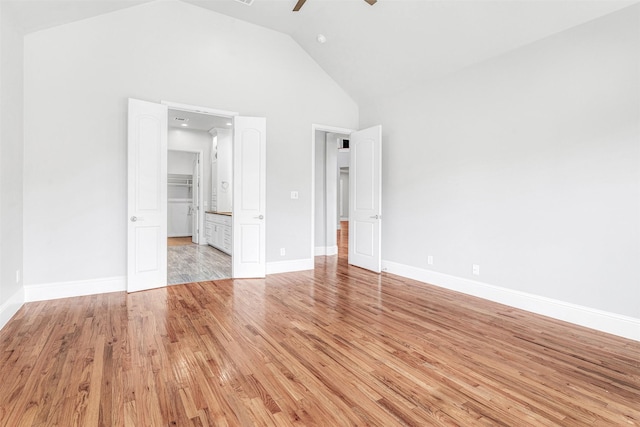 11334 Graceland Ln, Frisco, TX 75033 - unfurnished bedroom featuring high vaulted ceiling, light wood-type flooring, connected bathroom, and a ceiling fan