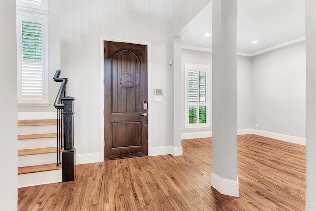 11334 Graceland Ln, Frisco, TX 75033 - entrance foyer featuring wood finished floors, crown molding, and stairs