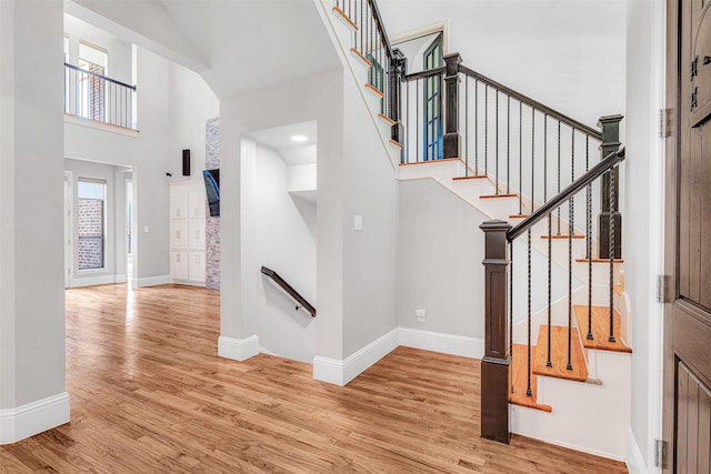 11334 Graceland Ln, Frisco, TX 75033 - entryway featuring a high ceiling, wood finished floors, and stairway