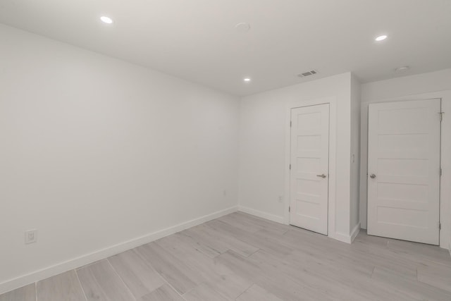 13516 Spring Grove Ave, Dallas, TX 75240 - spare room with recessed lighting and light wood finished floors
