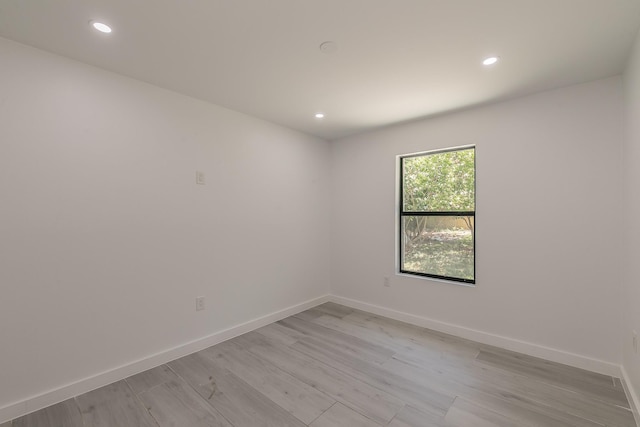 13516 Spring Grove Ave, Dallas, TX 75240 - empty room featuring light wood finished floors and recessed lighting