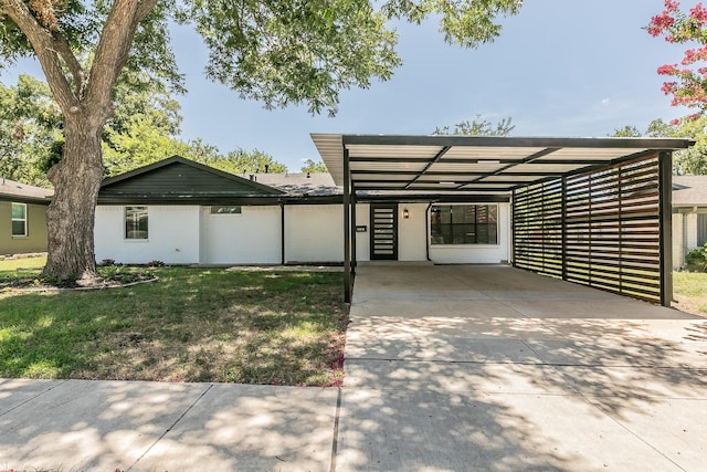 13516 Spring Grove Ave, Dallas, TX 75240 - view of front of home featuring concrete driveway, a carport, and a front yard