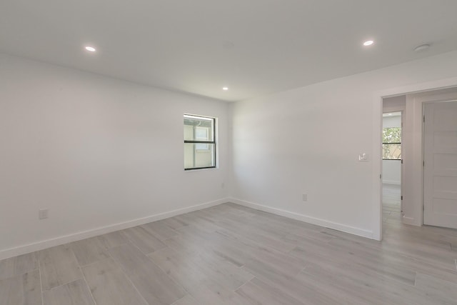 13516 Spring Grove Ave, Dallas, TX 75240 - unfurnished room featuring plenty of natural light, light wood-style flooring, and recessed lighting