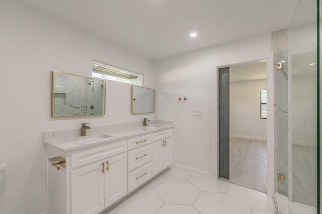 13516 Spring Grove Ave, Dallas, TX 75240 - full bathroom with double vanity, a marble finish shower, and recessed lighting