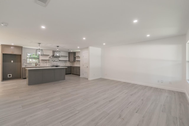 13516 Spring Grove Ave, Dallas, TX 75240 - kitchen with open shelves, decorative backsplash, recessed lighting, a kitchen island, and light wood-style floors
