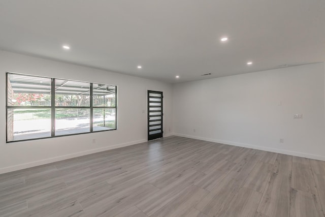 13516 Spring Grove Ave, Dallas, TX 75240 - spare room with light wood-style flooring and recessed lighting