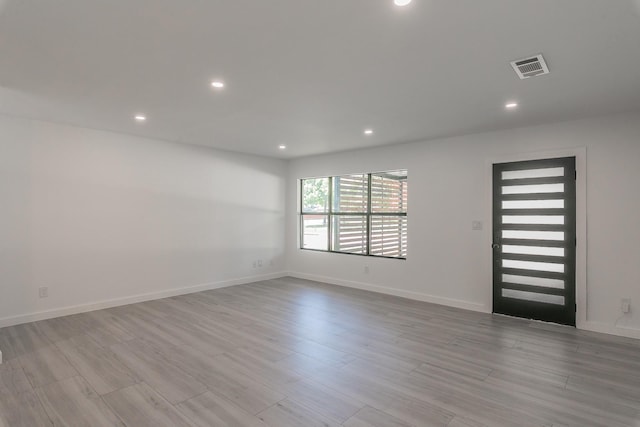 13516 Spring Grove Ave, Dallas, TX 75240 - spare room with recessed lighting and wood finished floors