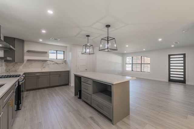 13516 Spring Grove Ave, Dallas, TX 75240 - kitchen featuring open shelves, stainless steel gas range, gray cabinetry, recessed lighting, and light wood-type flooring