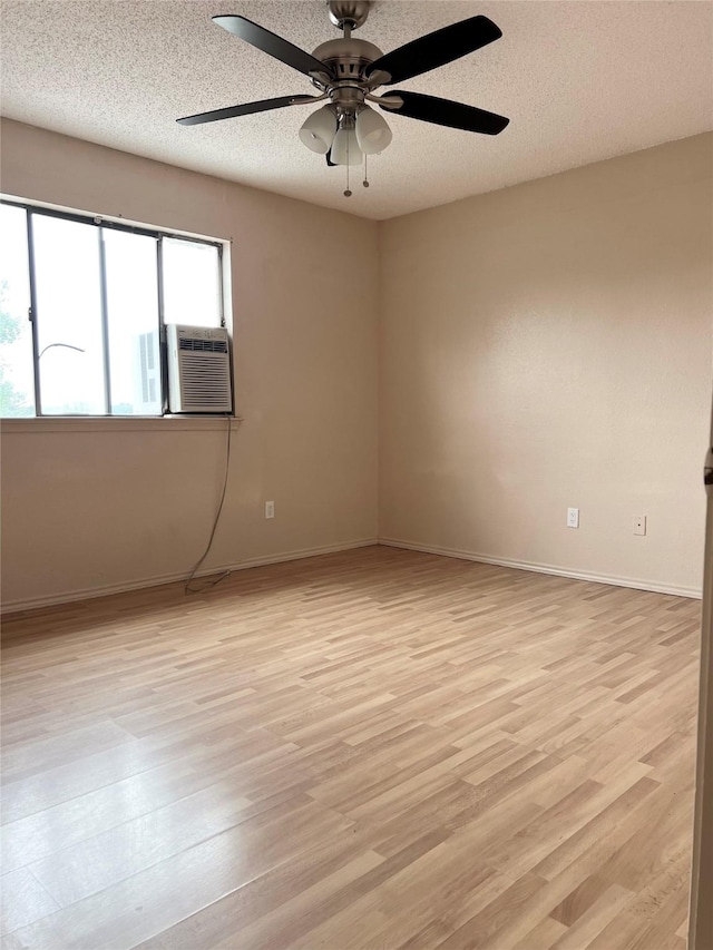 1429 Keisa Ln, Irving, TX 75060 - spare room with a ceiling fan, light wood-type flooring, a textured ceiling, and cooling unit