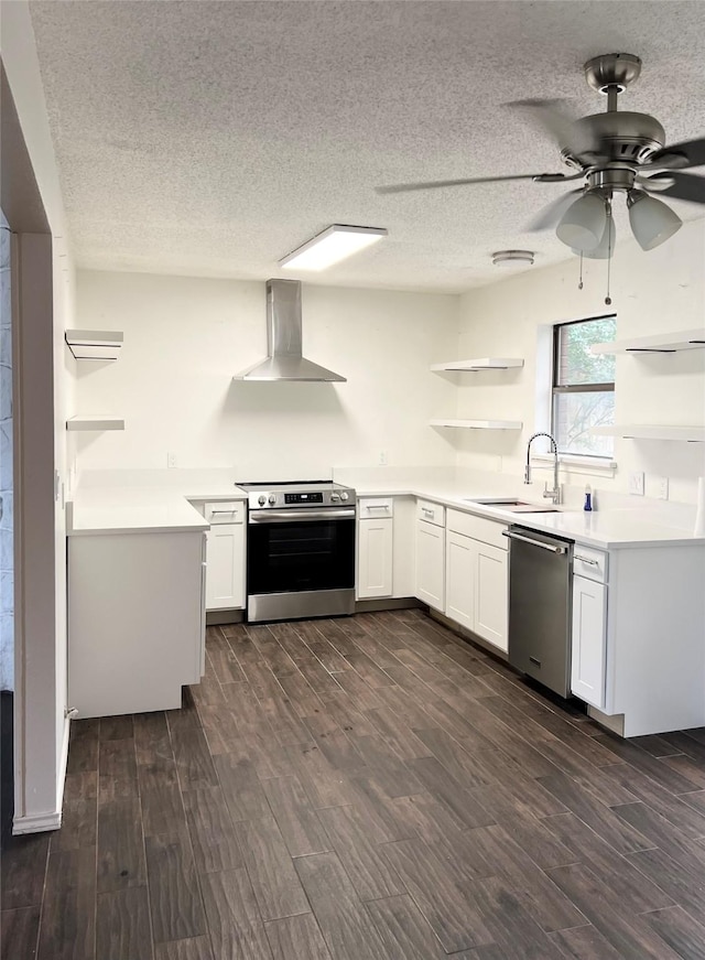1429 Keisa Ln, Irving, TX 75060 - kitchen featuring wall chimney exhaust hood, stainless steel appliances, open shelves, dark wood-type flooring, and a ceiling fan