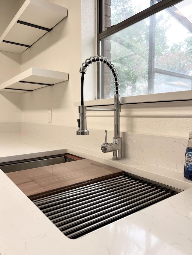 1429 Keisa Ln, Irving, TX 75060 - kitchen view of a sink and light stone countertops