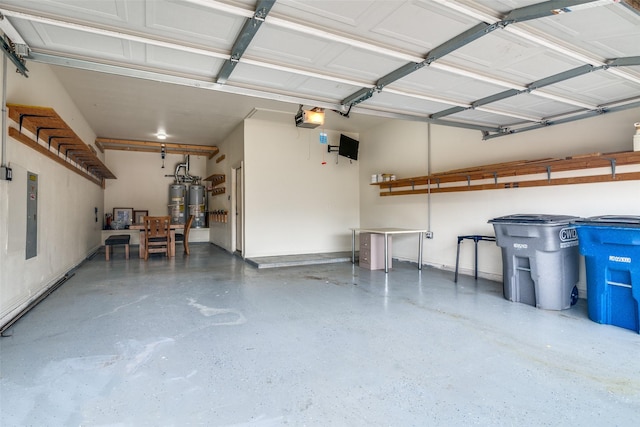 7611 Forest Ridge Trl, Sachse, TX 75048 - garage featuring a garage door opener and water heater