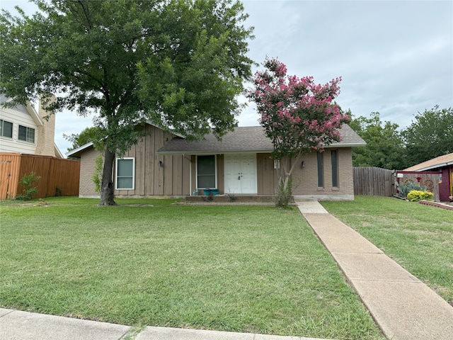 4005 Tacoma St, Irving, TX 75062 - view of front of property featuring board and batten siding, a shingled roof, and brick siding