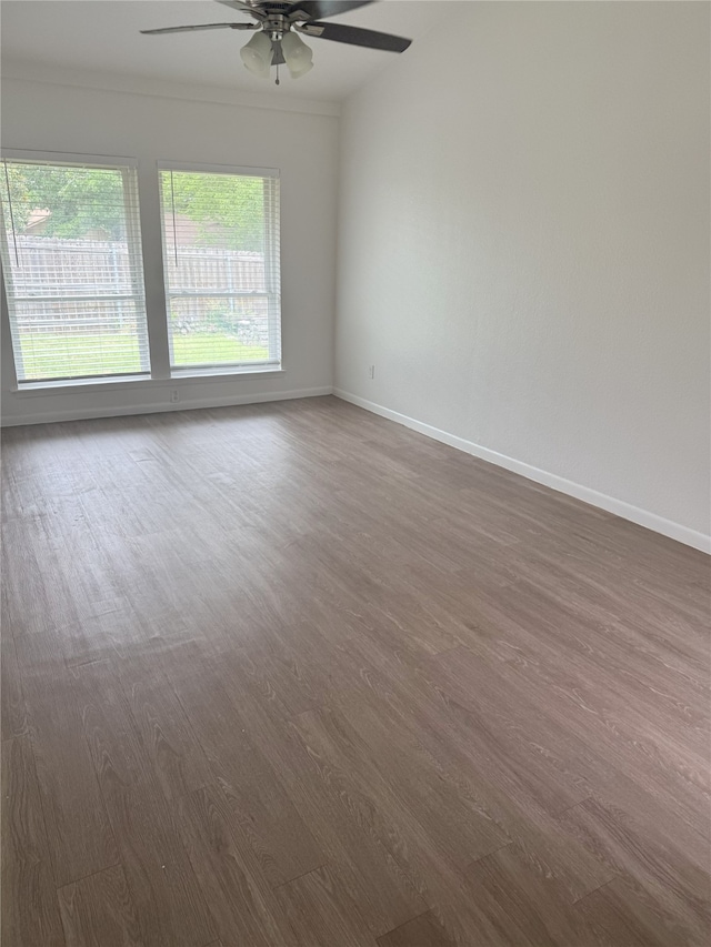 4005 Tacoma St, Irving, TX 75062 - unfurnished room featuring ceiling fan and dark wood-type flooring