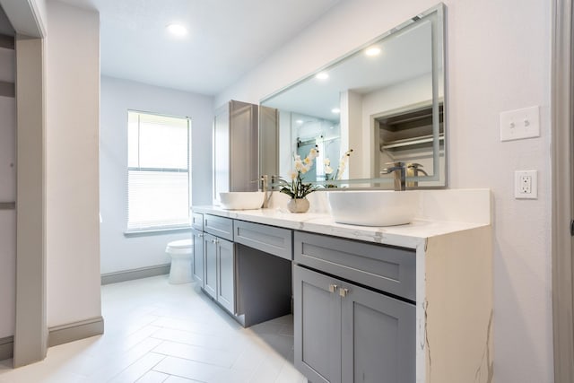 947 Aspen Dr, Desoto, TX 75115 - full bathroom with double vanity, recessed lighting, and a shower