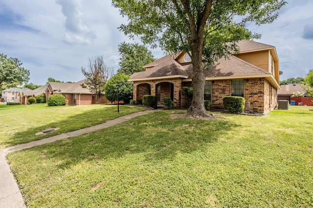 947 Aspen Dr, Desoto, TX 75115 - view of front of property featuring brick siding, a front lawn, and a shingled roof