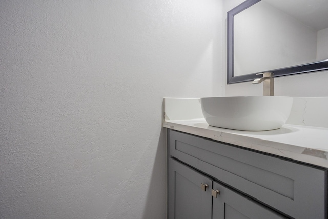 947 Aspen Dr, Desoto, TX 75115 - bathroom featuring vanity and a textured wall