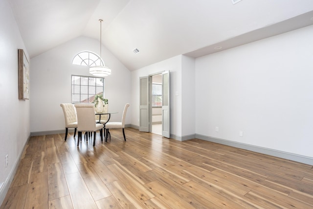 947 Aspen Dr, Desoto, TX 75115 - dining area featuring light wood-style floors and vaulted ceiling