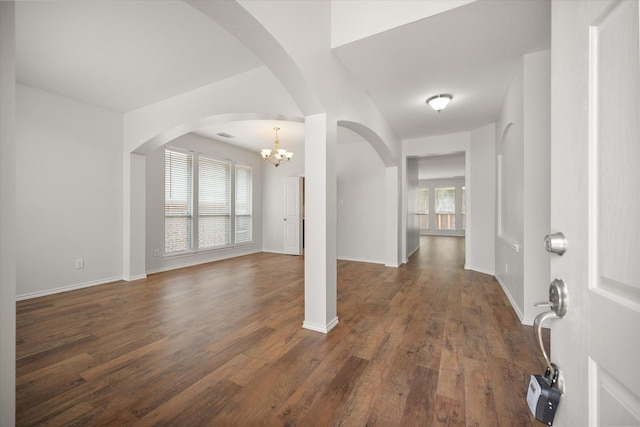 4208 Glen Garden Dr, Arlington, TX 76016 - foyer featuring dark wood-style flooring, a chandelier, and arched walkways