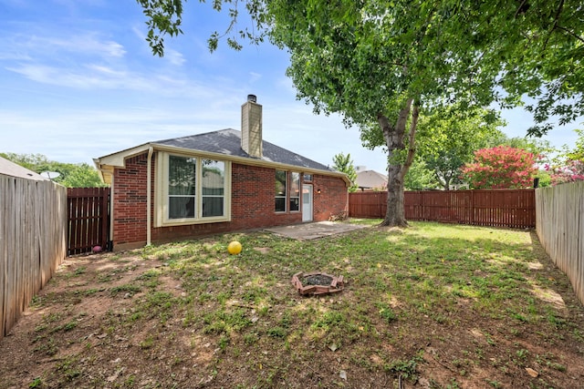 90 Elmwood Trl, Waxahachie, TX 75165 - rear view of property featuring a chimney, a patio, a fenced backyard, and brick siding
