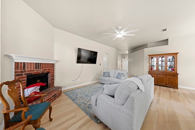 90 Elmwood Trl, Waxahachie, TX 75165 - living area featuring a ceiling fan, light wood finished floors, and a fireplace